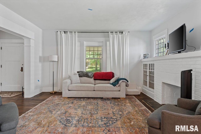 1424 S Lowell Ave, Springfield, IL 62704 - living room featuring healthy amount of natural light, wood finished floors, and a brick fireplace
