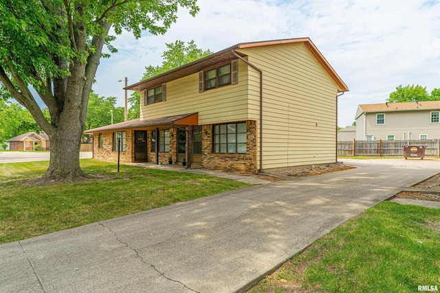 147 Northville Dr, Lincoln, IL 62656 - view of front of house with concrete driveway and brick siding