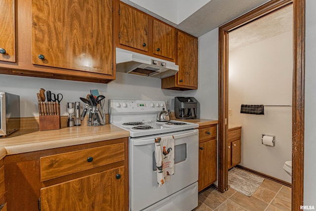 147 Northville Dr, Lincoln, IL 62656 - kitchen featuring white electric range oven, under cabinet range hood, brown cabinetry, and light countertops