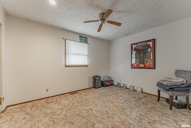 147 Northville Dr, Lincoln, IL 62656 - carpeted empty room featuring a ceiling fan and a textured ceiling