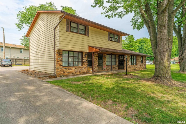 147 Northville Dr, Lincoln, IL 62656 - view of front facade featuring brick siding, driveway, and covered porch