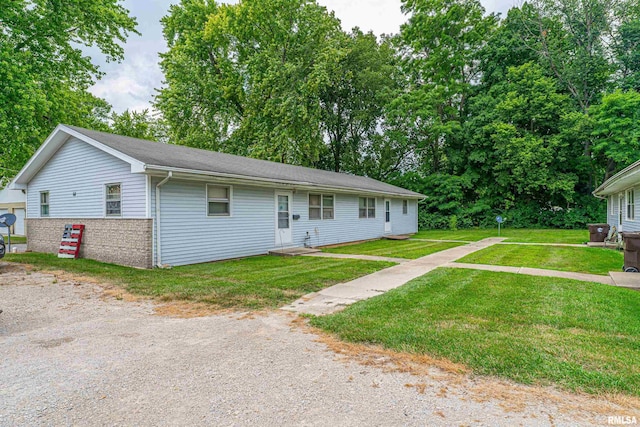 64 Gavin St, Lincoln, IL 62656 - ranch-style home with a front yard and brick siding