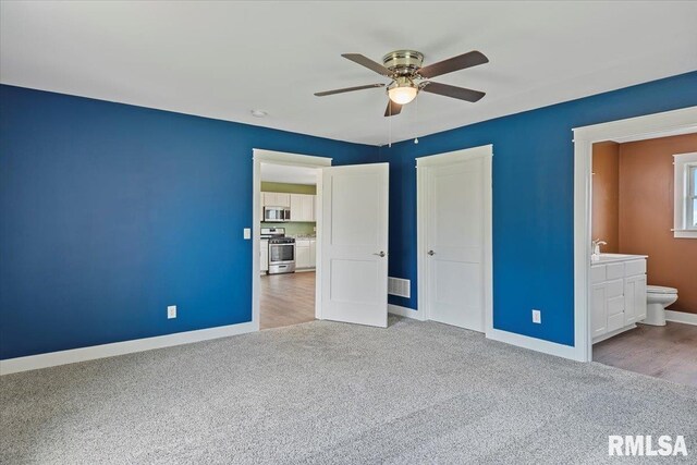210 Prairie Run, Illiopolis, IL 62539 - unfurnished bedroom featuring carpet floors, a closet, connected bathroom, and ceiling fan