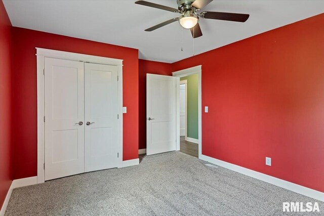 210 Prairie Run, Illiopolis, IL 62539 - unfurnished bedroom with carpet floors, a closet, and ceiling fan