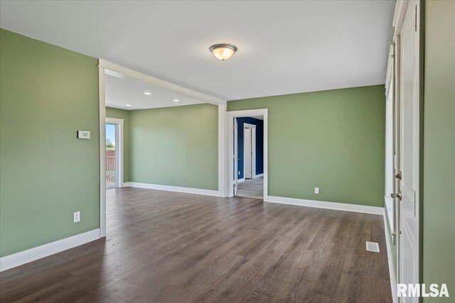 210 Prairie Run, Illiopolis, IL 62539 - empty room with dark wood-type flooring and recessed lighting