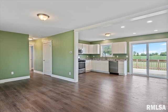 210 Prairie Run, Illiopolis, IL 62539 - kitchen with stainless steel appliances, white cabinetry, dark wood-type flooring, recessed lighting, and open floor plan