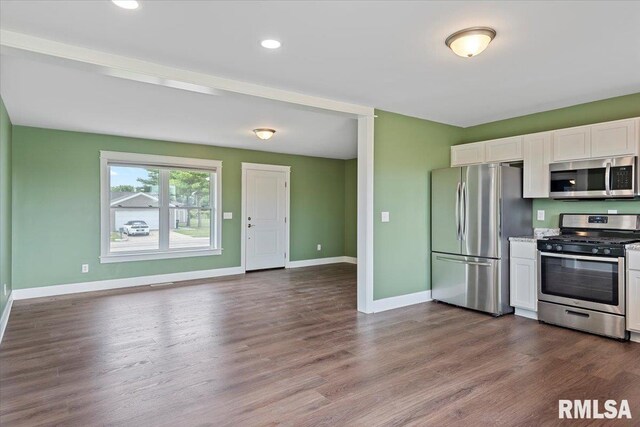 210 Prairie Run, Illiopolis, IL 62539 - kitchen with stainless steel appliances, white cabinets, dark wood-type flooring, light countertops, and recessed lighting