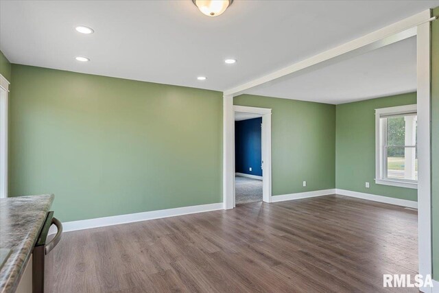 210 Prairie Run, Illiopolis, IL 62539 - spare room featuring dark wood-style floors and recessed lighting