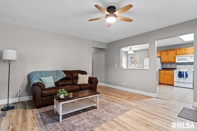 3328 Mars Ave, Springfield, IL 62707 - living room featuring light wood finished floors and a ceiling fan