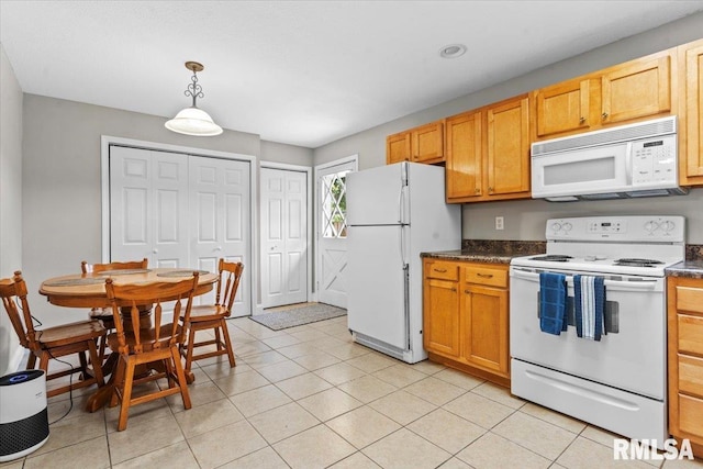 3328 Mars Ave, Springfield, IL 62707 - kitchen with white appliances, dark countertops, pendant lighting, and light tile patterned flooring