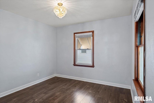 2912 E Enos Ave, Springfield, IL 62702 - spare room featuring a chandelier and dark wood finished floors
