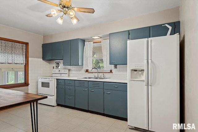 2912 E Enos Ave, Springfield, IL 62702 - kitchen featuring white appliances, light countertops, ceiling fan, and decorative backsplash