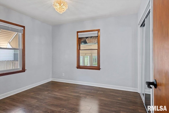 2912 E Enos Ave, Springfield, IL 62702 - unfurnished room with dark wood finished floors and a chandelier