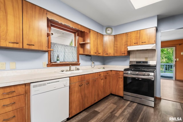 113 W Walnut St, Chatham, IL 62629 - kitchen with white dishwasher, gas range, under cabinet range hood, light countertops, and dark wood-style flooring