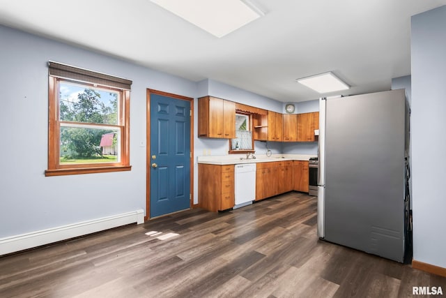 113 W Walnut St, Chatham, IL 62629 - kitchen featuring appliances with stainless steel finishes, a baseboard radiator, dark wood-style floors, light countertops, and healthy amount of natural light