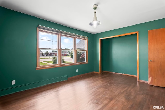 113 W Walnut St, Chatham, IL 62629 - spare room with wood finished floors and a baseboard radiator