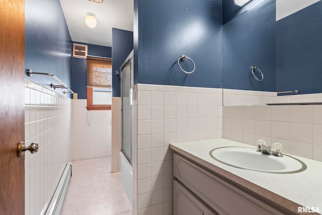 113 W Walnut St, Chatham, IL 62629 - full bath with tile walls, vanity, a baseboard radiator, tile patterned floors, and a wainscoted wall