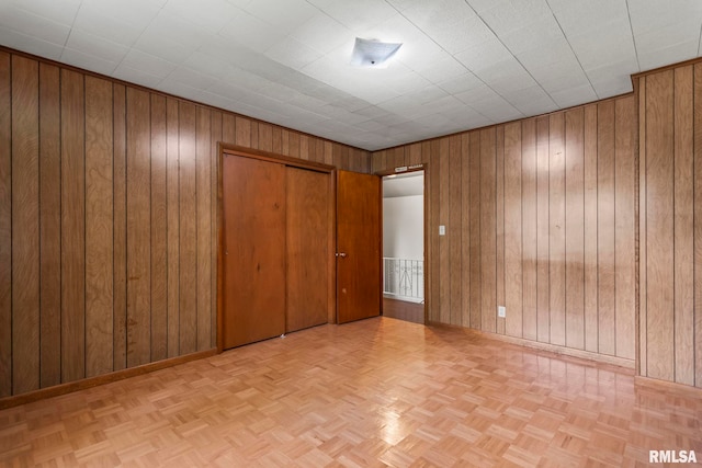 113 W Walnut St, Chatham, IL 62629 - unfurnished bedroom featuring wooden walls and a closet