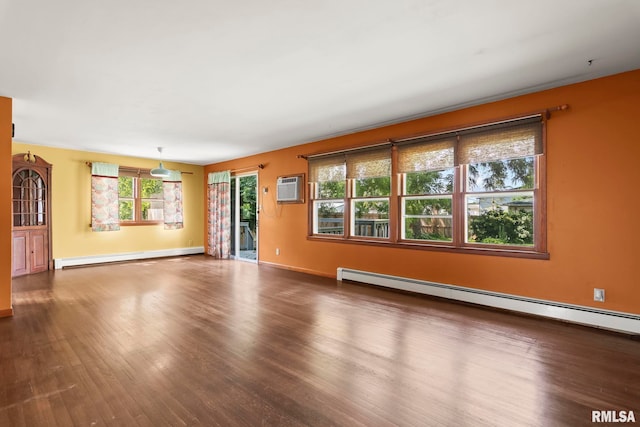 113 W Walnut St, Chatham, IL 62629 - unfurnished living room featuring baseboard heating, wood finished floors, and a wall mounted air conditioner