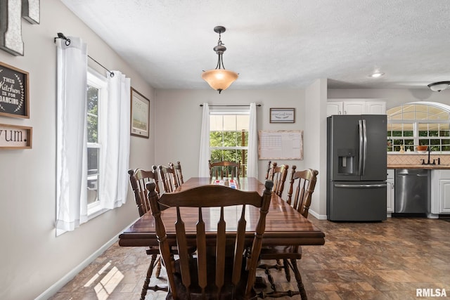 16540 Wernowsky St, Petersburg, IL 62675 - dining space featuring stone finish floors and a textured ceiling