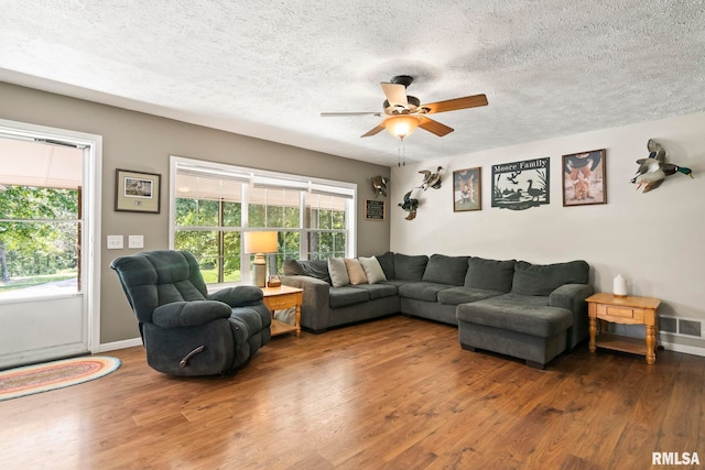 16540 Wernowsky St, Petersburg, IL 62675 - living room featuring a ceiling fan, wood finished floors, and a textured ceiling