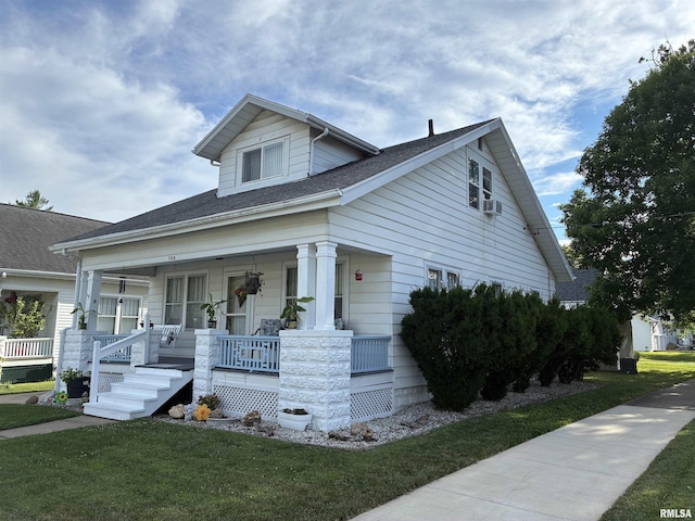 700 S 20th St, Quincy, IL 62301 - bungalow-style home featuring covered porch, a front yard, and a shingled roof