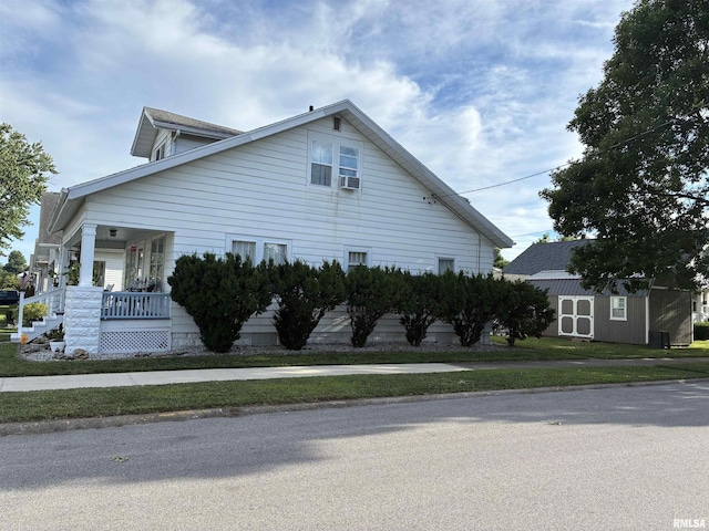 700 S 20th St, Quincy, IL 62301 - view of property exterior with cooling unit, a storage unit, and a porch
