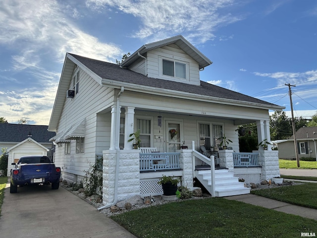700 S 20th St, Quincy, IL 62301 - bungalow-style home with a porch, driveway, and roof with shingles