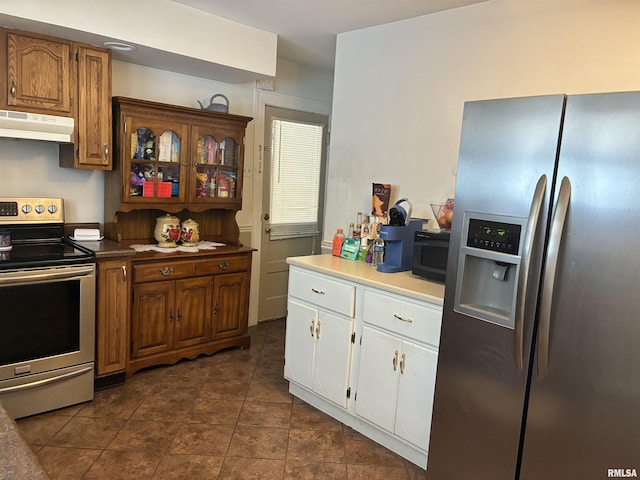 700 S 20th St, Quincy, IL 62301 - kitchen featuring stainless steel appliances, under cabinet range hood, white cabinetry, dark tile patterned flooring, and brown cabinets