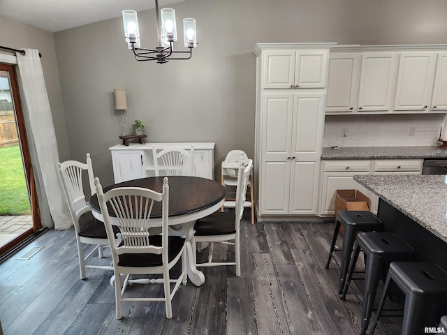 2302 Knoxville Dr, Springfield, IL 62711 - dining area featuring dark wood-style flooring and a chandelier