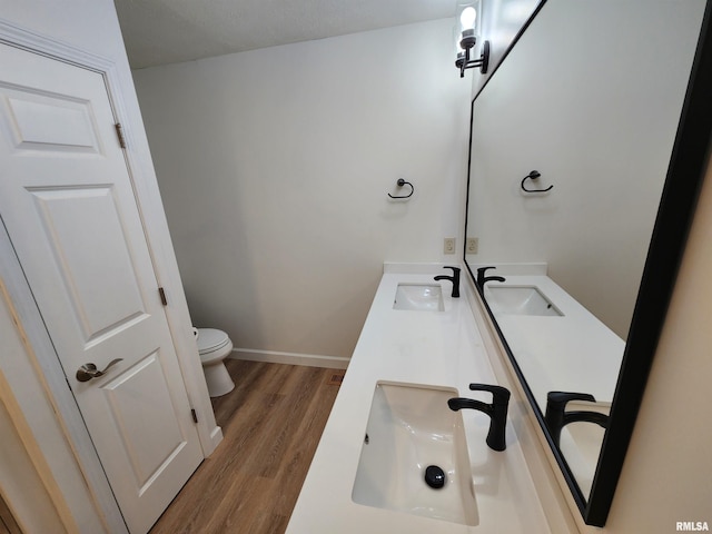 2302 Knoxville Dr, Springfield, IL 62711 - full bath featuring wood finished floors and double vanity