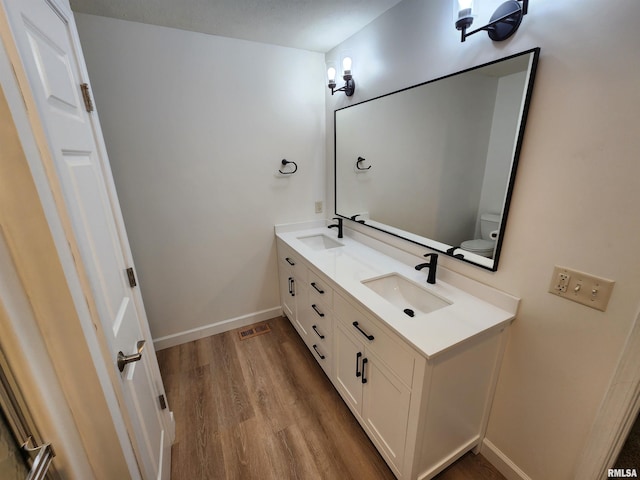 2302 Knoxville Dr, Springfield, IL 62711 - bathroom with wood finished floors and double vanity