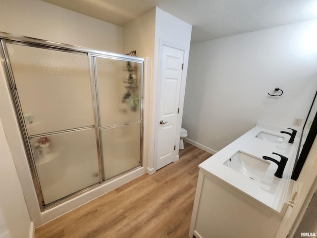 2302 Knoxville Dr, Springfield, IL 62711 - bathroom with wood finished floors, a stall shower, and double vanity