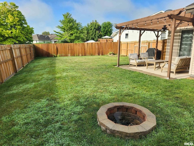 2302 Knoxville Dr, Springfield, IL 62711 - fenced backyard with a pergola, a patio area, an outdoor fire pit, and ceiling fan