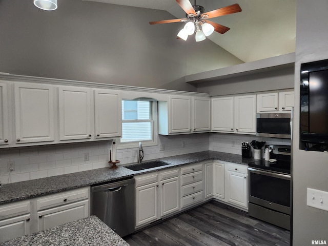 2302 Knoxville Dr, Springfield, IL 62711 - kitchen with appliances with stainless steel finishes, white cabinetry, a ceiling fan, tasteful backsplash, and dark wood-style flooring