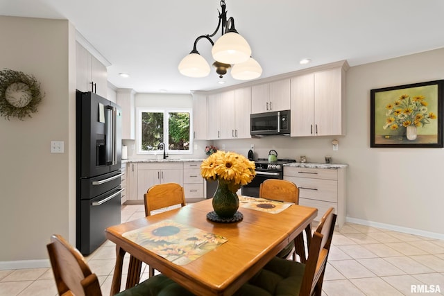 4905 Eagles Lndg, Springfield, IL 62711 - kitchen with appliances with stainless steel finishes, light tile patterned floors, hanging light fixtures, a chandelier, and recessed lighting