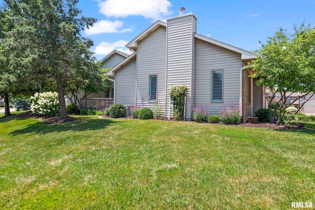 4905 Eagles Lndg, Springfield, IL 62711 - view of home's exterior with a lawn and a chimney