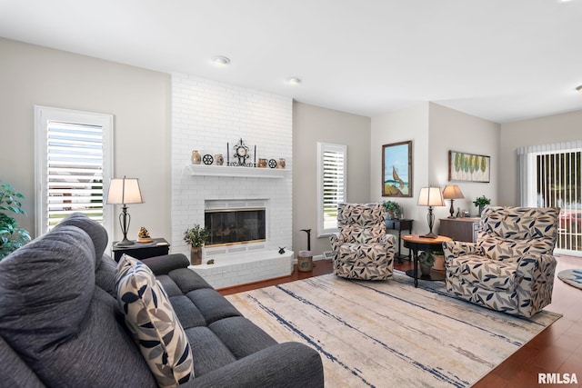4905 Eagles Lndg, Springfield, IL 62711 - living room with wood finished floors, a brick fireplace, and recessed lighting