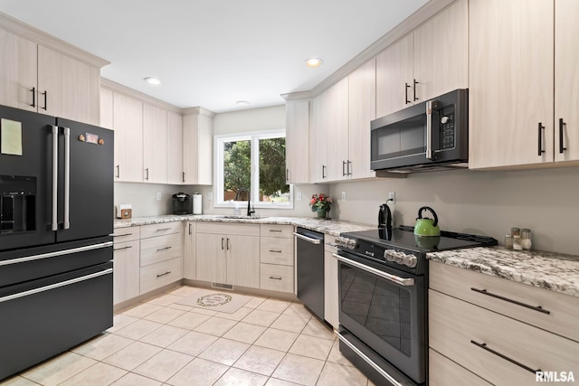 4905 Eagles Lndg, Springfield, IL 62711 - kitchen with stainless steel appliances, light brown cabinets, light stone counters, light tile patterned floors, and recessed lighting