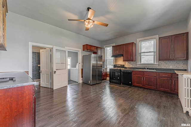 418 E Cooke St, Mount Pulaski, IL 62548 - kitchen with black appliances, under cabinet range hood, a ceiling fan, dark wood-style floors, and decorative backsplash