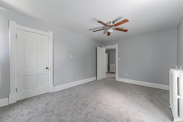 418 E Cooke St, Mount Pulaski, IL 62548 - unfurnished bedroom featuring carpet floors, radiator heating unit, and ceiling fan