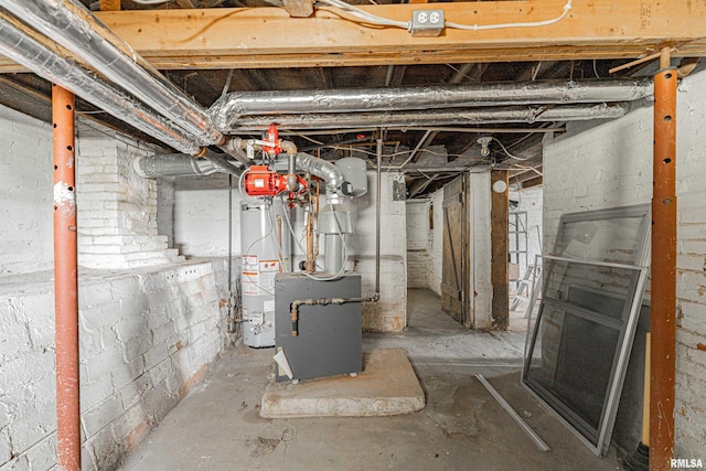 418 E Cooke St, Mount Pulaski, IL 62548 - unfinished basement featuring gas water heater