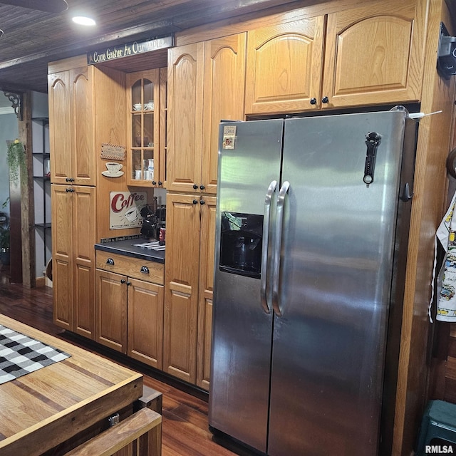 704 N Cherry St, Abingdon, IL 61410 - kitchen featuring stainless steel fridge, dark wood-style flooring, glass insert cabinets, dark countertops, and recessed lighting