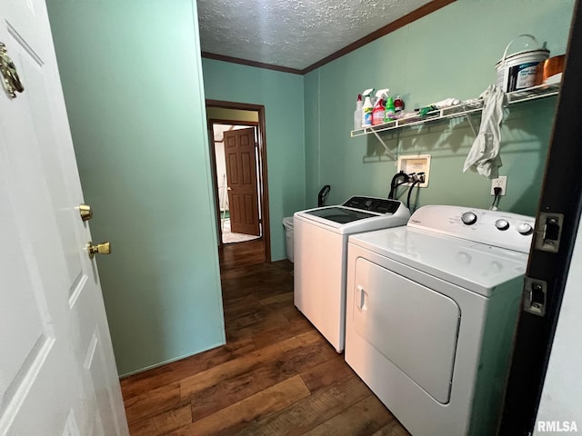 517 S Obannon St, Raymond, IL 62560 - laundry room with washer and dryer, dark wood-style floors, a textured ceiling, and ornamental molding
