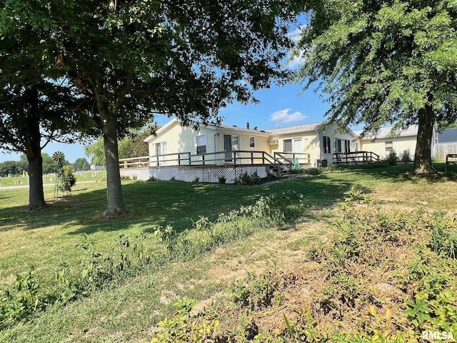 517 S Obannon St, Raymond, IL 62560 - view of green lawn featuring a deck
