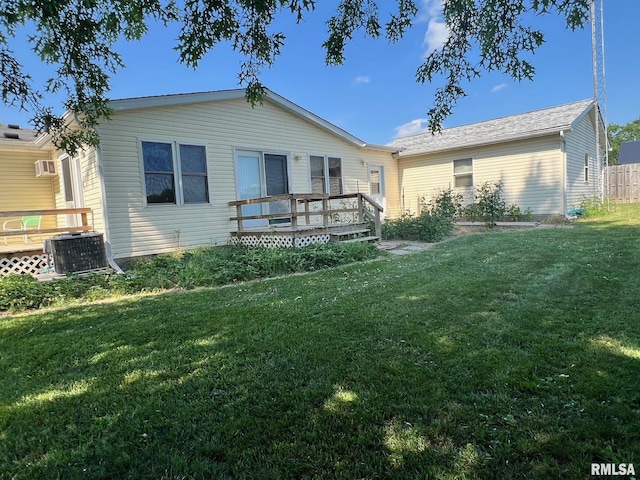 517 S Obannon St, Raymond, IL 62560 - single story home featuring a wooden deck, a front yard, and a wall mounted air conditioner