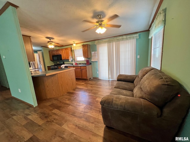 517 S Obannon St, Raymond, IL 62560 - living area with a ceiling fan, hardwood / wood-style flooring, and ornamental molding