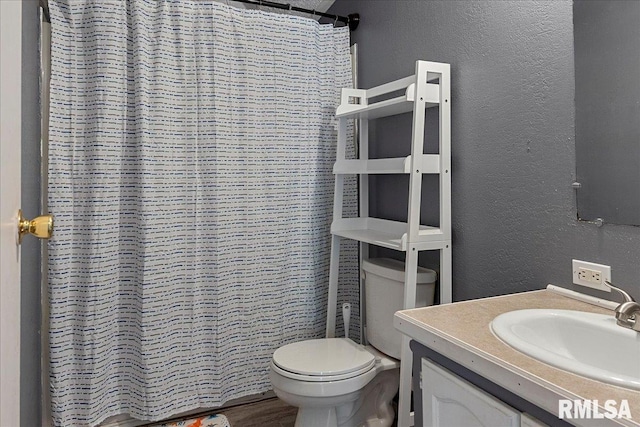 913 Springfield St, Kincaid, IL 62540 - full bathroom featuring a textured wall, vanity, and curtained shower