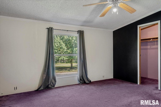 913 Springfield St, Kincaid, IL 62540 - unfurnished bedroom featuring carpet, a textured ceiling, crown molding, a walk in closet, and a ceiling fan