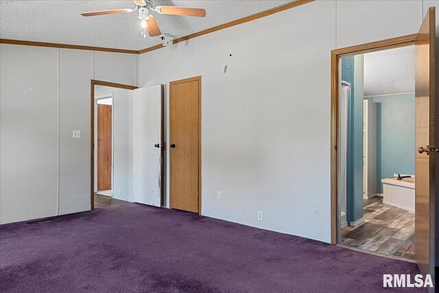 913 Springfield St, Kincaid, IL 62540 - unfurnished bedroom featuring ornamental molding, carpet, a textured ceiling, connected bathroom, and a ceiling fan